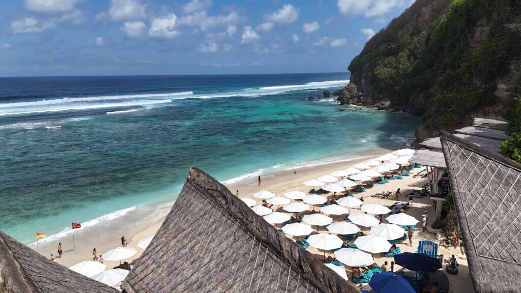 A beach with a bunch of umbrellas on it